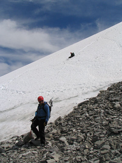 The snow slope is actually part of the glacier clinging to Nigel Peak's north face.