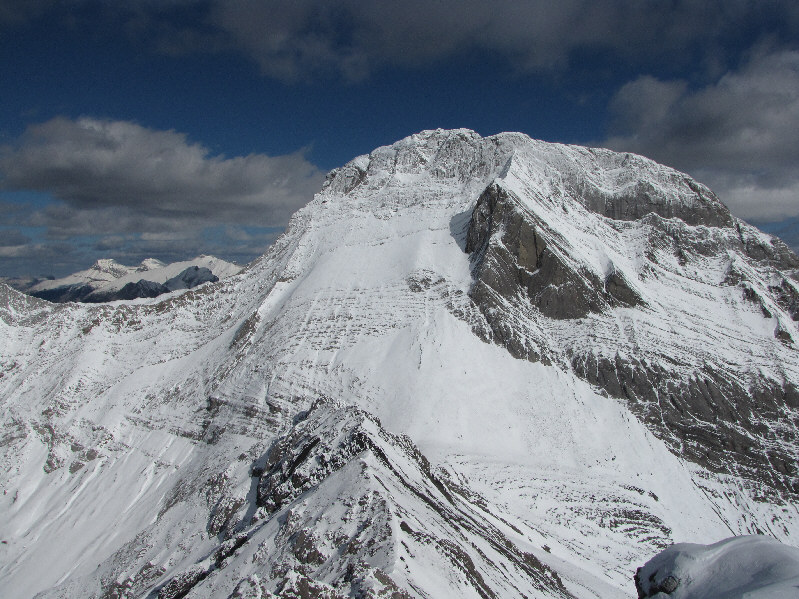 Over Mount Smuts' left shoulder are peaks 1 and 2 of Mount Lougheed and Mount Sparrowhawk.