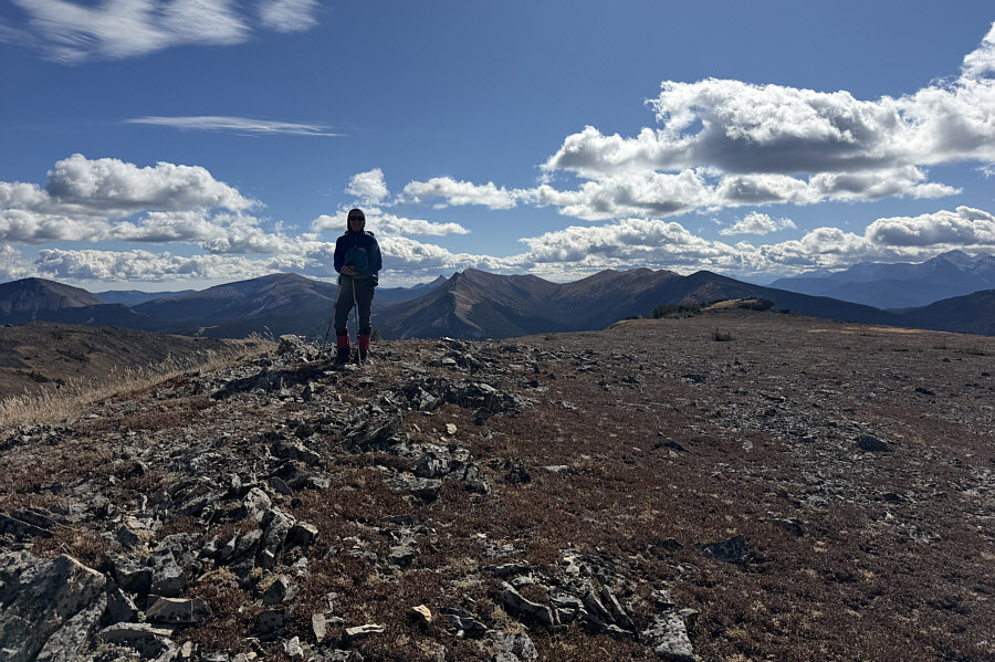 Hmmm...that rock outcrop in the distance looks higher...maybe!