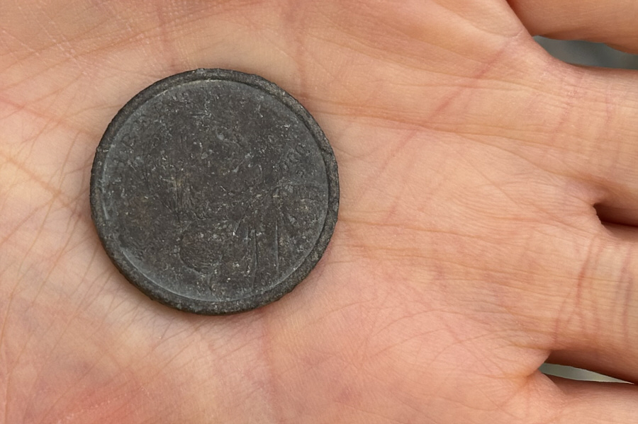 A most unusual coin to find on a mountain!