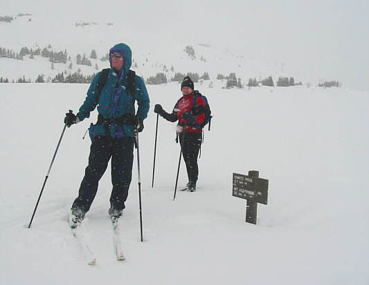The sign says, "Quartz Ridge 3.7 km ->; Mount Assiniboine 30 km ->".
