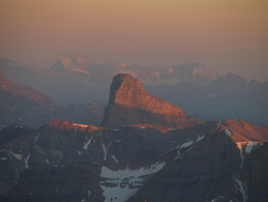 Mount Ball and Stanley Peak are also visible in the hazy distance.