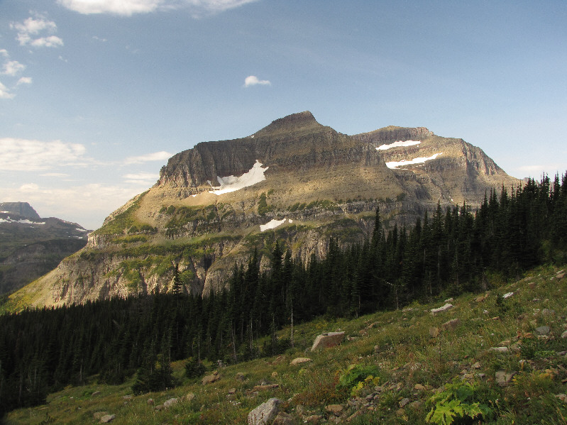 The true summit of Piegan Mountain is the point on the right above the double snow patches.