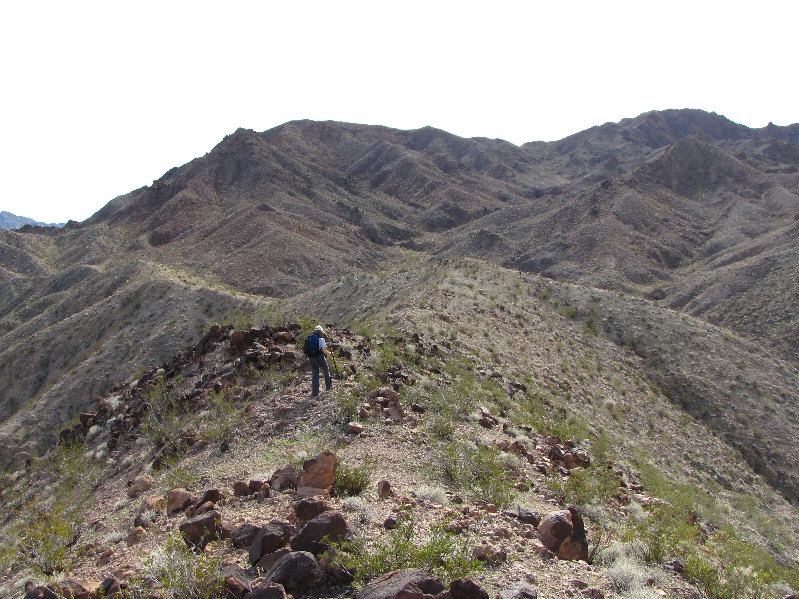We regained the normal route at the saddle just above and to the left of Kelly in the photo.